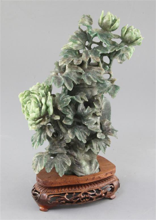 A Chinese green mottled jadeite vase and cover, 20th century, height 22cm, wood stand